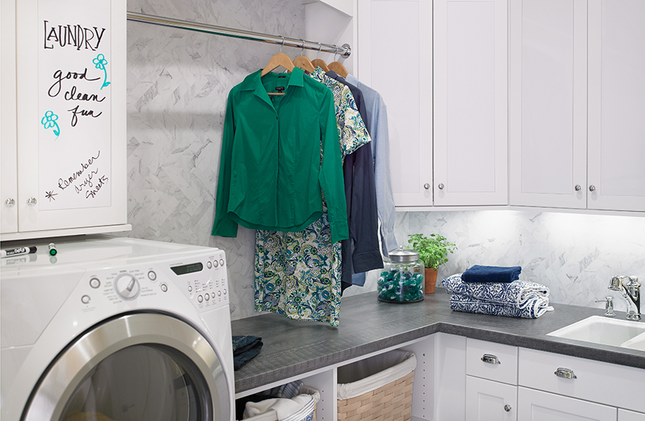 This laundry room utilizes Formica® Laminate on the cabinets, counters and backsplash. 6416 Charred Formwood 9310 White Marble Herringbone 949 White Markerboard