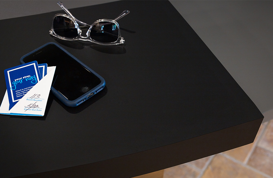 Table top with cell phone and sunglasses 909 Black Formica Infiniti ColorCore2
